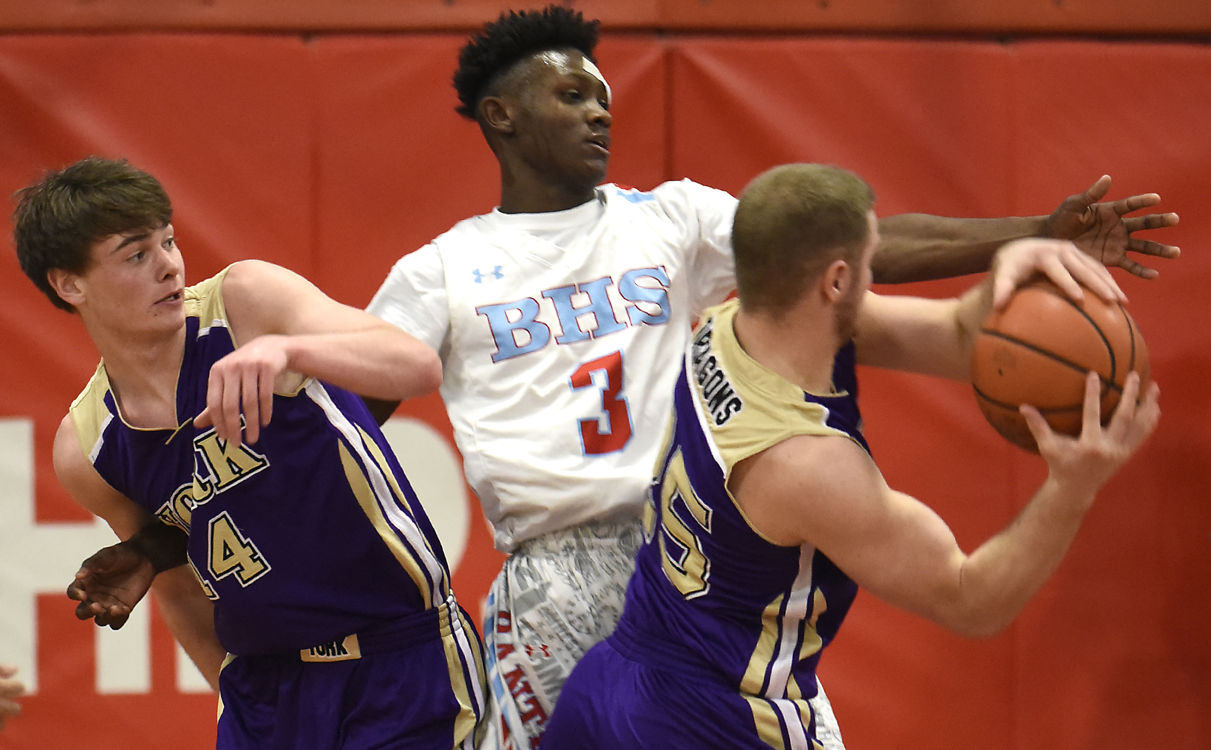 Brainerd's Trey Owten (3) is tied up with York's Case Moody (14) as he defends Landrick Leffew (25).The Brainerd High Panthers hosted the York Institute Dragons in a Class AA TSSAA sectional game on March 4, 2019.