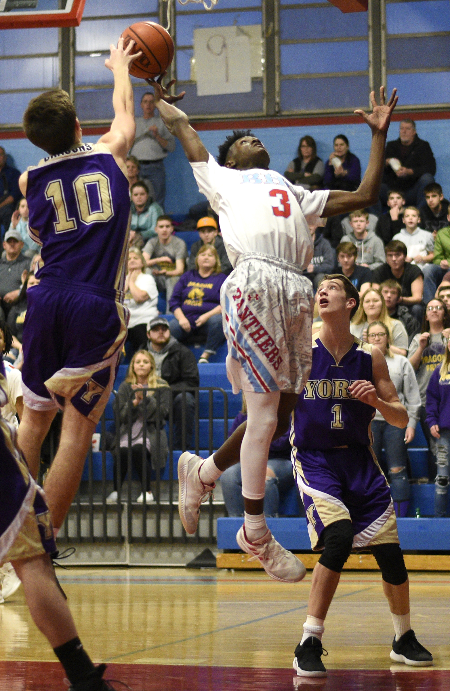 Brainerd's Trey Owten (3) struggles with York's Roger Meadows (10) for a rebound. The Brainerd High Panthers hosted the York Institute Dragons in a Class AA TSSAA sectional game on March 4, 2019.
