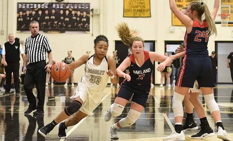 Bradley Central's Jamaryn Blair dribbles past Oakland's Claira McGowan during a Class AAA sectional last Saturday night in Cleveland, Tenn. The host Bearettes won to advance to the state tournament in Murfreesboro.