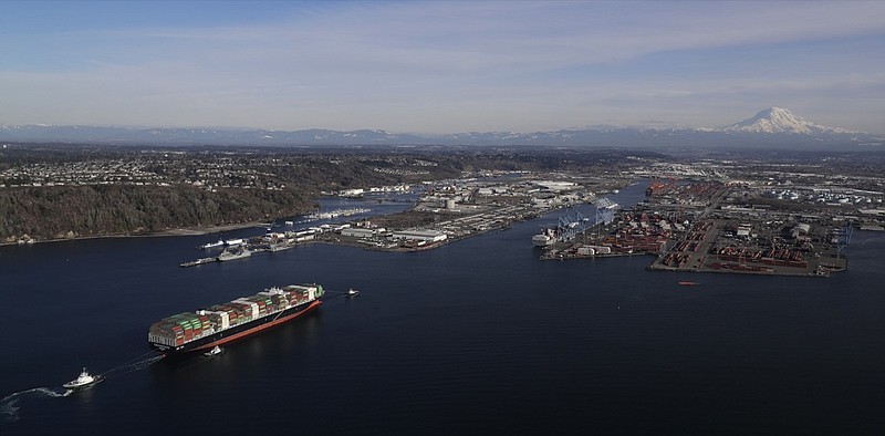 In this Tuesday, March 5, 2019, file photo the Cape Kortia container ship heads into the Port of Tacoma in Commencement Bay. The U.S. trade deficit jumped nearly 19 percent in December, pushing the trade imbalance for all of 2018 to widen to a decade-long high of $621 billion. The gap with China on goods widened to an all-time record of $419.2 billion. (AP Photo/Ted S. Warren, File)