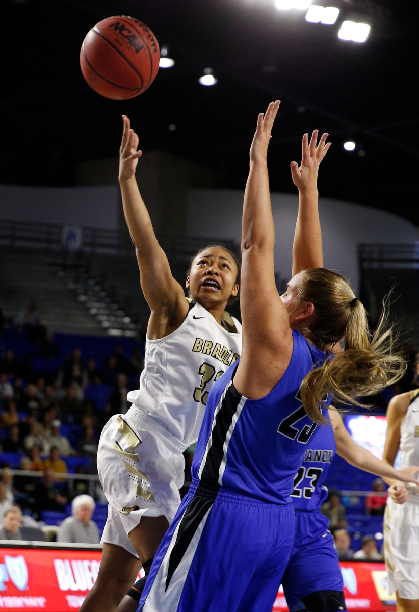 Bradley Central point guard Jamaryn Blair (33) shoots over Lebanon wing Alissa Mulaski (25) during the Bearettes' TSSAA Class AAA girls basketball quarterfinal against the Lady Blue Devils at Middle Tennessee State University's Murphy Center on Thursday, March 7, 2019, in Murfreesboro, Tenn.
