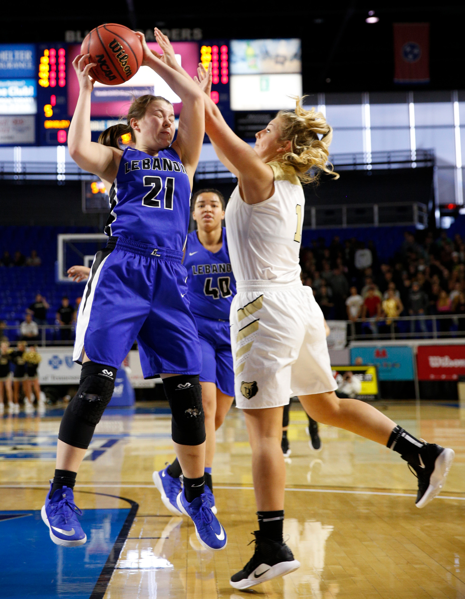 Lebanon point guard Addie Porter (21) rebounds over Bradley Central shooting guard Kaleigh Hughes (1) during the Bearettes' TSSAA Class AAA girls basketball quarterfinal against the Lady Blue Devils at Middle Tennessee State University's Murphy Center on Thursday, March 7, 2019, in Murfreesboro, Tenn.