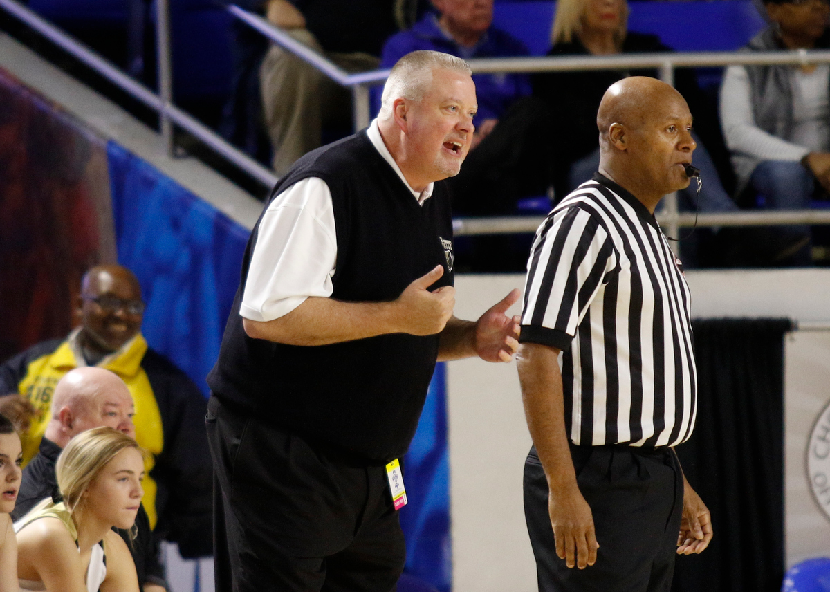 Bradley Central girls basketball coach Jason Reuter shouts to an official following a call during the Bearettes' TSSAA Class AAA girls basketball quarterfinal against the Lebanon Lady Blue Devils at Middle Tennessee State University's Murphy Center on Thursday, March 7, 2019, in Murfreesboro, Tenn.