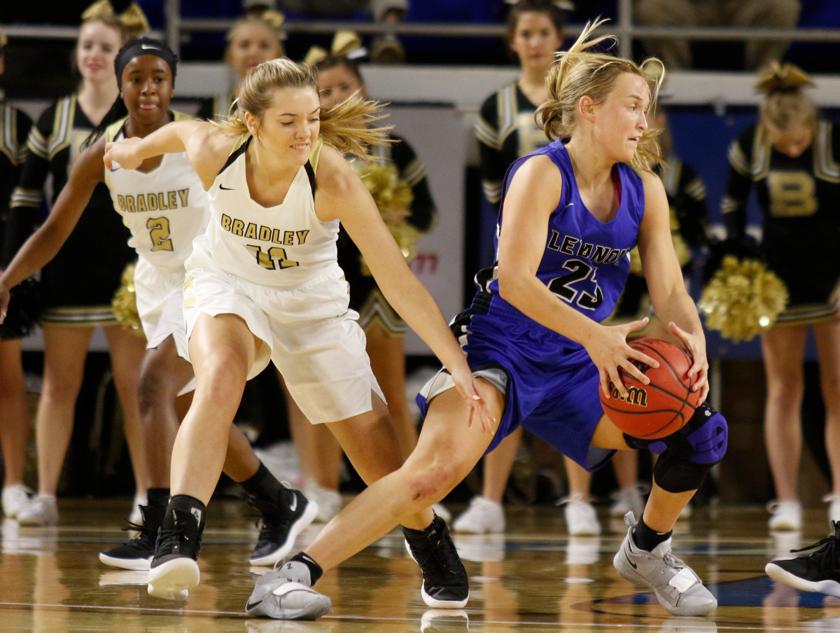 Lebanon wing Lindsey Freeman (23) secures a loose ball ahead of Bradley Central shooting guard Amelia Reuter (11) during the Bearettes' TSSAA Class AAA girls basketball quarterfinal against the Lady Blue Devils at Middle Tennessee State University's Murphy Center on Thursday, March 7, 2019, in Murfreesboro, Tenn.
