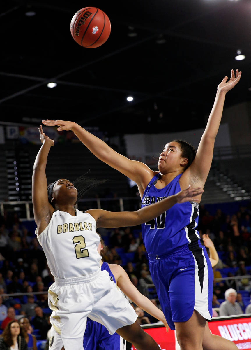 Bradley Central shooting guard Jamia Williams (2) shoots around Lebanon center Christaney Brookshire (40) during the Bearettes' TSSAA Class AAA girls basketball quarterfinal against the Lady Blue Devils at Middle Tennessee State University's Murphy Center on Thursday, March 7, 2019, in Murfreesboro, Tenn.