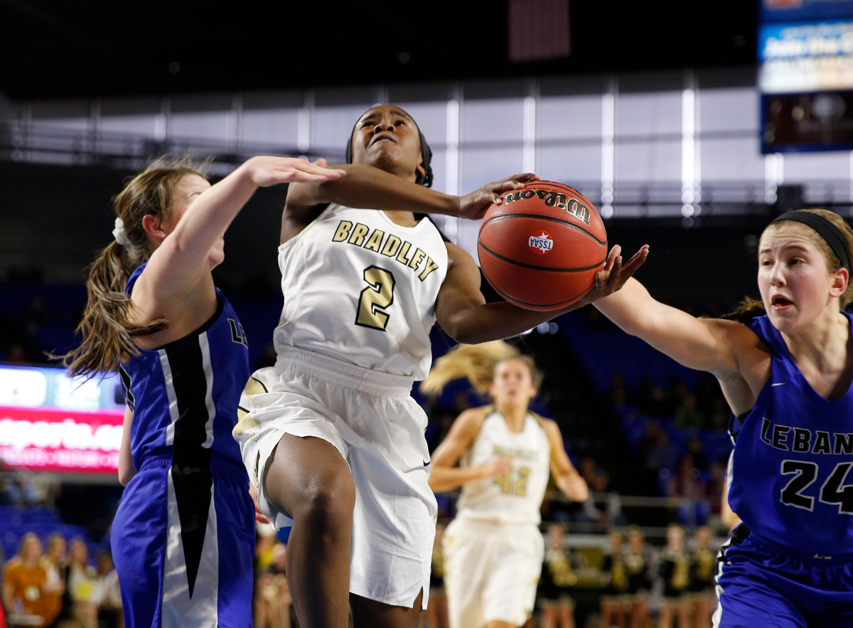 Bradley Central's Jamia Williams shoots between Lebanon's Aaryn Lester, right, and Addie Porter during a TSSAAA Class AAA state quarterfinal Thursday in Murfreesboro. Bradley Central won 34-26 and advanced to a semifinal against Oak Ridge, which is coached by former Bearettes star Paige Redman.