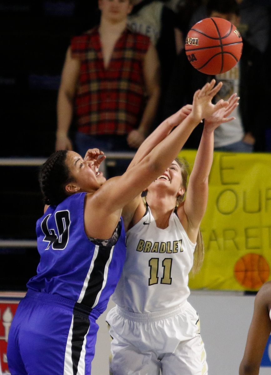 Bradley Central shooting guard Amelia Reuter (11) rebounds against Lebanon center Christaney Brookshire (40) during the Bearettes' TSSAA Class AAA girls basketball quarterfinal against the Lady Blue Devils at Middle Tennessee State University's Murphy Center on Thursday, March 7, 2019, in Murfreesboro, Tenn.
