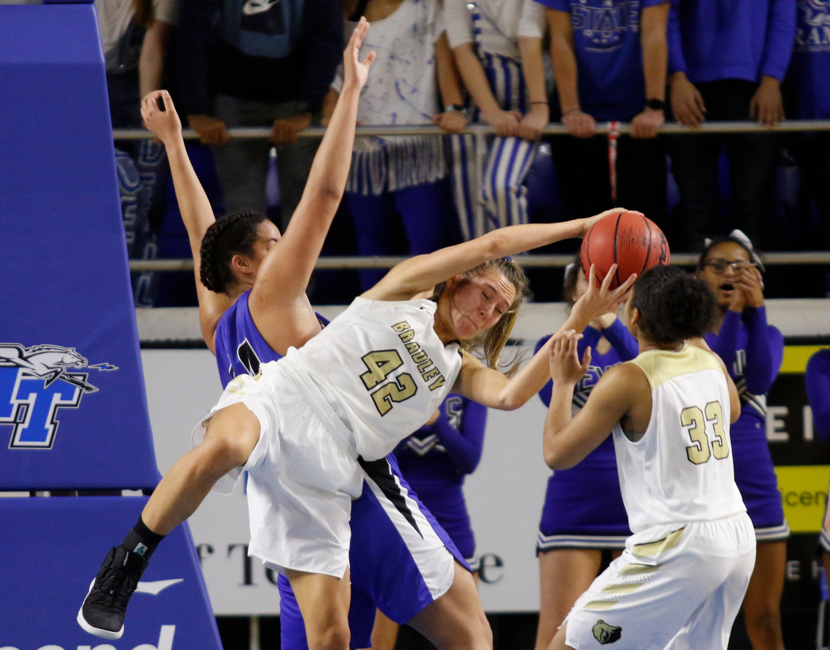 Bradley Central's Anna Walker grabs a rebound in front of Lebanon's Christaney Brookshire during a TSSAA Class AAA state quarterfinal Thursday at Middle Tennessee State.