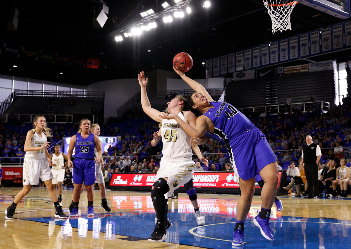 Lebanon center Christaney Brookshire (40) rebounds over Bradley Central power forward Hannah Lombard (45) during the Bearettes' TSSAA Class AAA girls basketball quarterfinal against the Lady Blue Devils at Middle Tennessee State University's Murphy Center on Thursday, March 7, 2019, in Murfreesboro, Tenn.