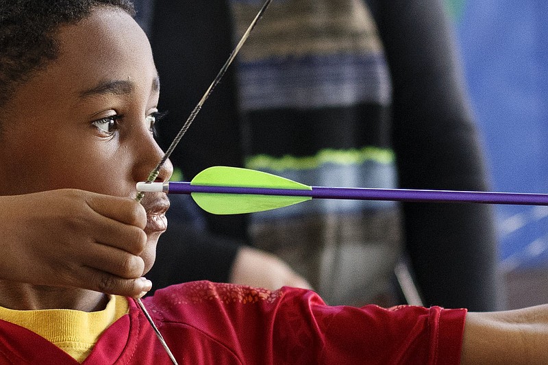 Ten-year-old Christopher Barber takes aim with his bow at Outdoor Chattanooga on Wednesday, March 6, 2019 in Chattanooga, Tenn. Outdoor Chattanooga is offering the free "Try Archery" program every Wednesday through the end of March from 3:30-6 p.m. No previous experience is required and equipment is provided.