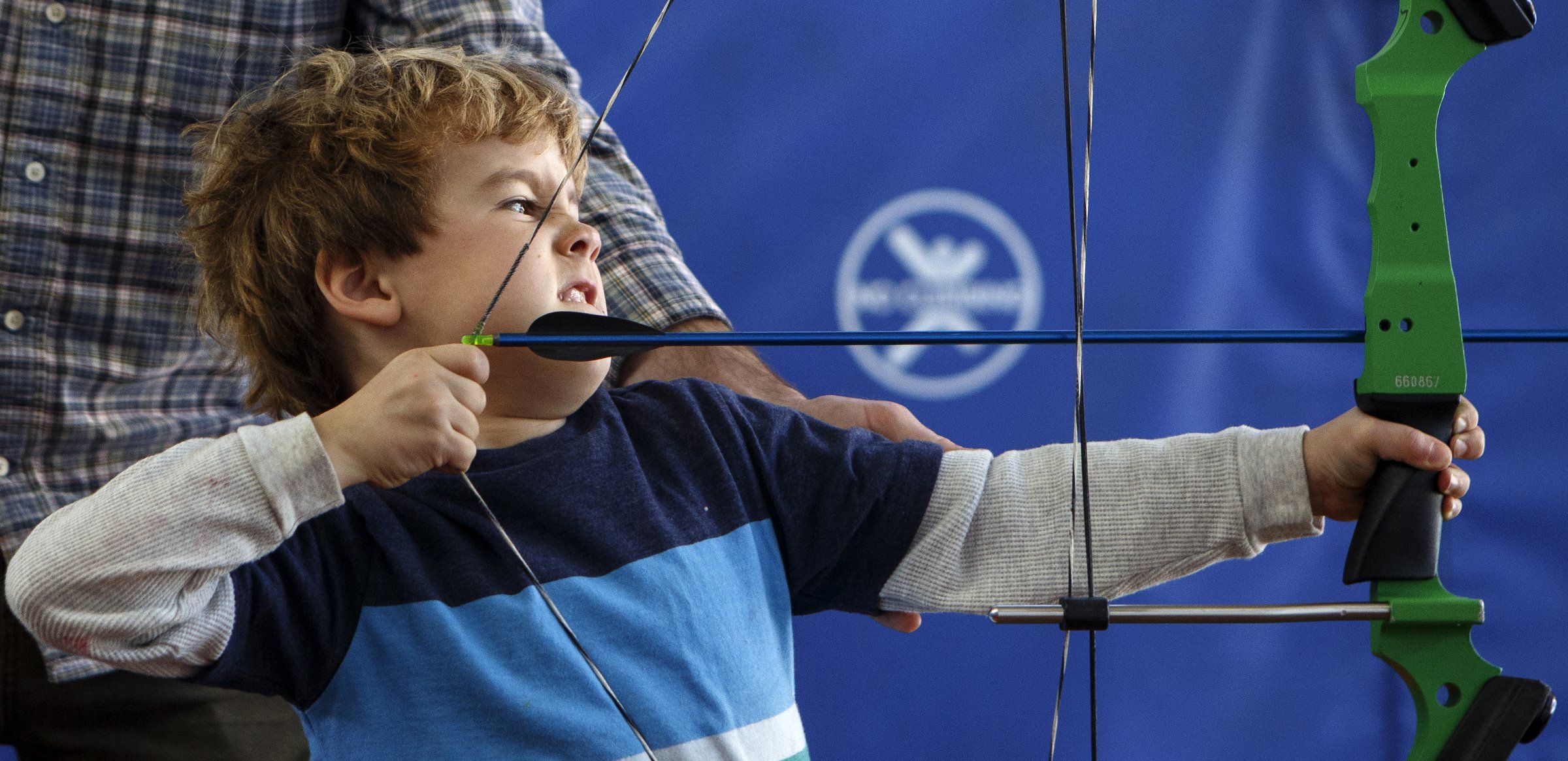 JD Mies strains to pull back his bow at Outdoor Chattanooga on Wednesday, March 6, 2019 in Chattanooga, Tenn. Outdoor Chattanooga is offering the free "Try Archery" program every Wednesday through the end of March from 3:30-6 p.m. No previous experience is required and equipment is provided.
