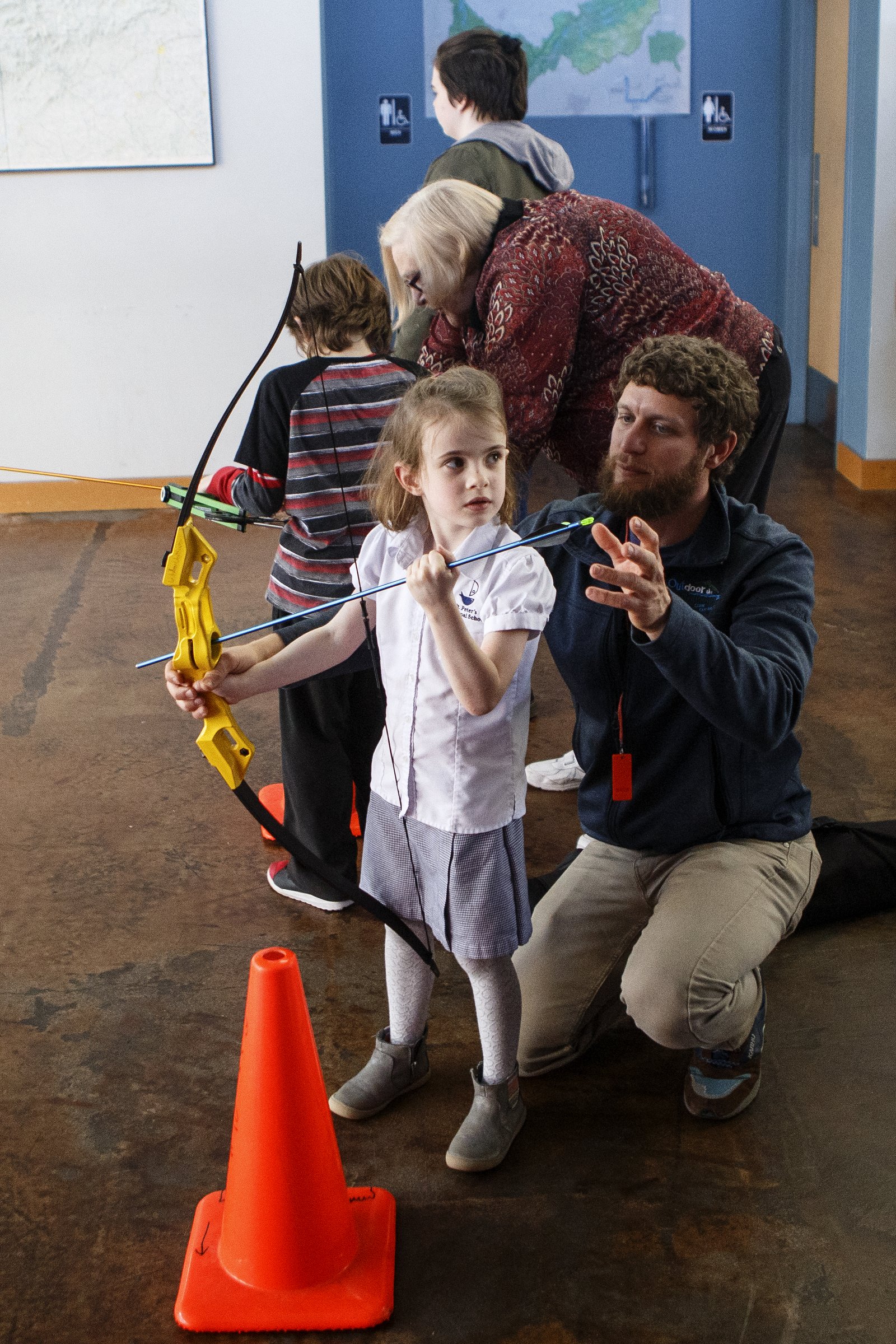 Six-year-old Libby Brown gets some help from James Eubank, a recreation specialist with Outdoor Chattanooga, at Outdoor Chattanooga on Wednesday, March 6, 2019 in Chattanooga, Tenn. Outdoor Chattanooga is offering the free "Try Archery" program every Wednesday through the end of March from 3:30-6 p.m. No previous experience is required and equipment is provided.