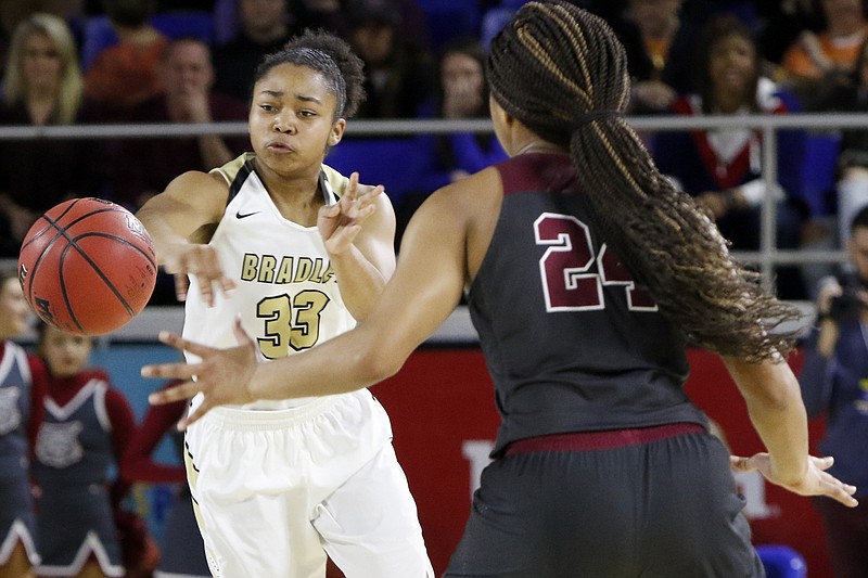 Bradley Central point guard Jamaryn Blair (33) fires the ball past Oak Ridge's Jada Guinn during a TSSAA Class AAA state semifinal Friday at MTSU's Murphy Center in Murfreesboro. Bradley Central won 56-50 in overtime and will play for its sixth state title Saturday when it takes on Houston.