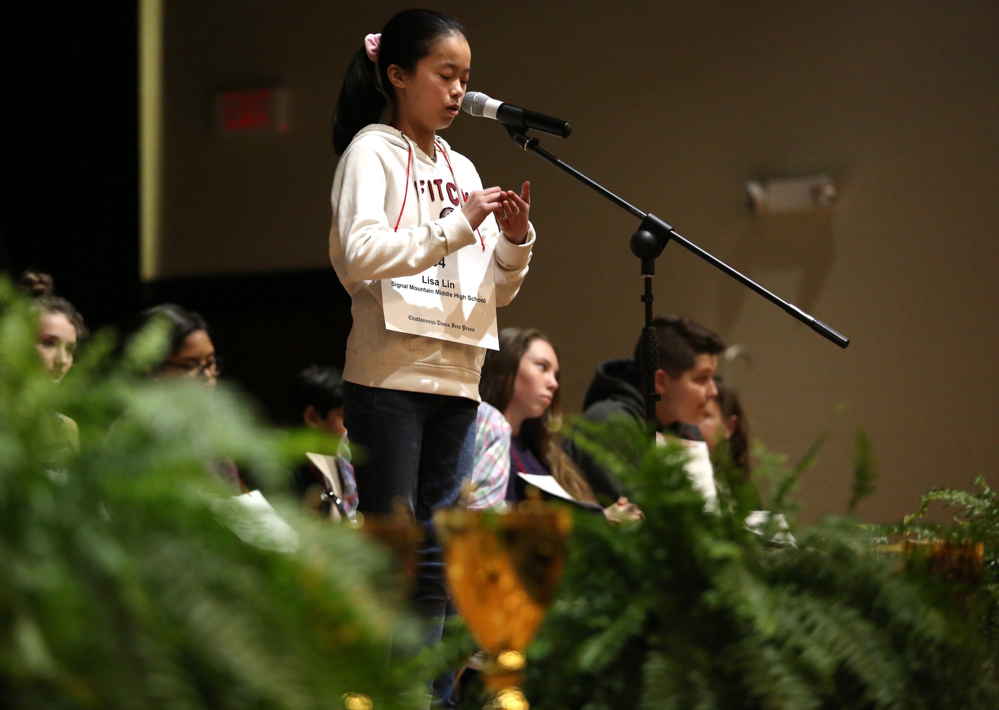 Lisa Lin of Signal Mountain Middle High School spells "hyperbole" during the 2019 Times Free Press Regional Spelling Bee Saturday, March 9, 2019 at the University of Tennessee at Chattanooga University Center.