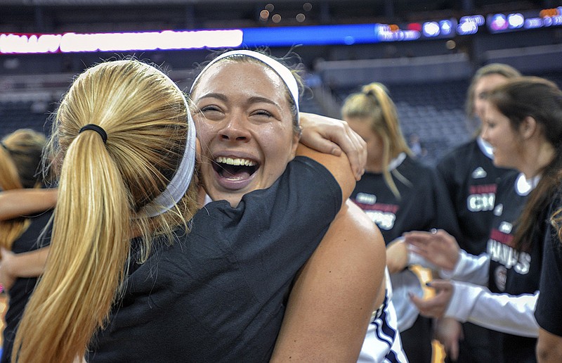 Belmont's Maddie Wright, right, gets a hug from teammate Hannah Harmeyer after the Bruins beat UT-Martin to win the Ohio Valley Conference women's basketball tournament in March in Evansville, Ind.