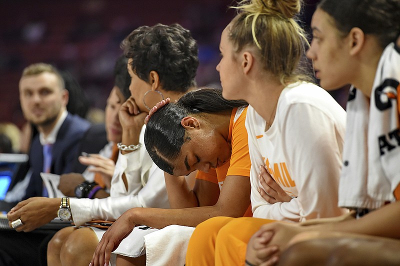 AP photo by Richard Shiro / Tennessee's Evina Westbrook, center, bows her head during the last minutes of the Lady Vols' loss to Mississippi State in the SEC women's tournament's quarterfinals in March 2019 in Greenville, S.C.