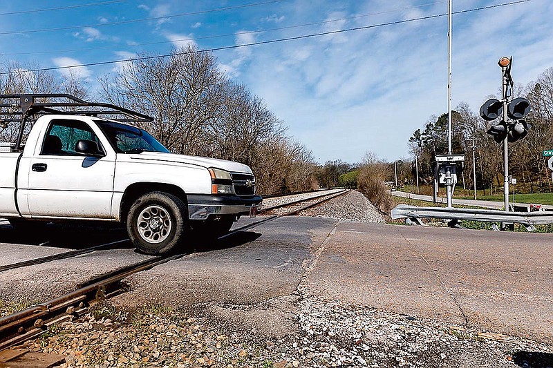 A truck travels over the Graysville Road railroad crossing on Tuesday, March 12, 2019, in Graysville, Ga. Catoosa County Commission Chairman Steve Henry wants to add a bridge over the tracks to mitigate long wait times at the crossing.