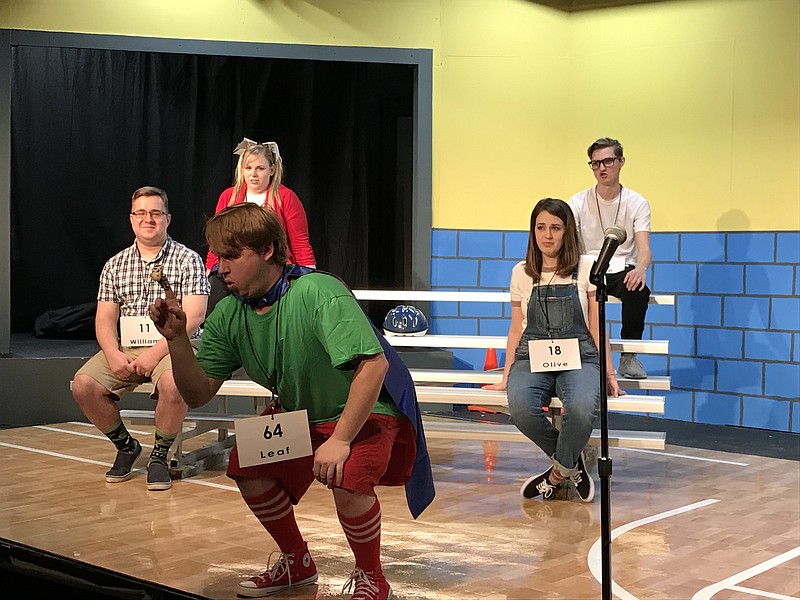 Adults play the middle-school spelling bee competitors. In front is Caleb Satterfield. In back, from left, are Robert Southerland, Ashlyn Barnett, Mary Mae Sims and Adam Stark.