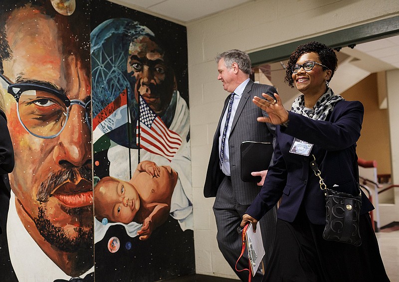 Principal LeAndrea Ware, right, walks with Geoff Ramsey past a mural as he shadows her for the morning at Howard School on Wednesday, Jan. 23, 2019, in Chattanooga, Tenn. Ramsey, the 2018 president of the Greater Chattanooga Association of Realtors, was one of 18 Hamilton County Schools' Leadership HCS participants who shadowed principals at schools across the county Wednesday.