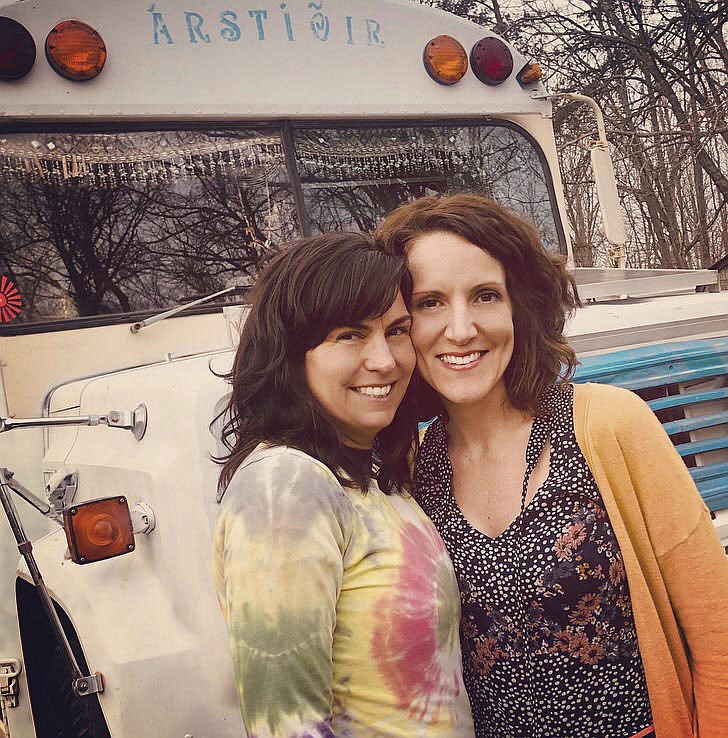 CSAS educators Ann-Marie Fitzsimmons and Niki Keck pose in front of a bus they hope to purchase to serve the homeless. / Contributed photo by Deva Holdson