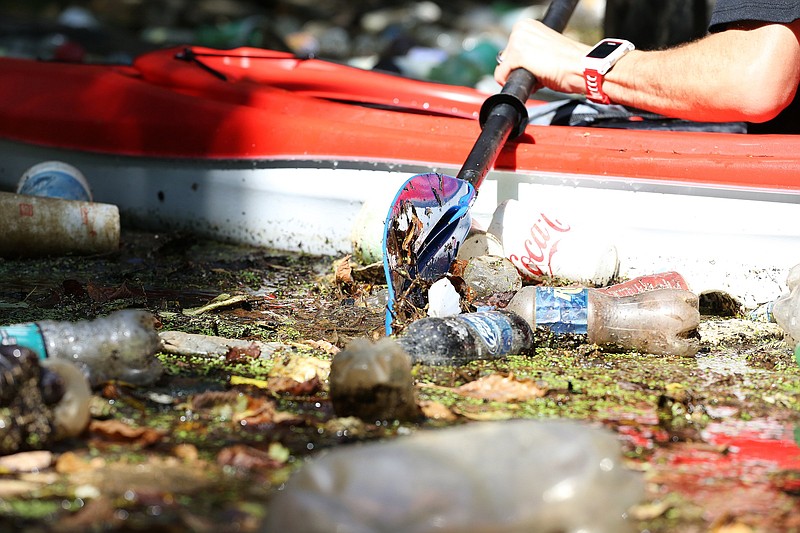 Styrofoam cups, plastic bottles, bags and other debris makes certain sections along Chattanooga Creek nearly impassible for paddlers Wednesday, August 8, 2018 in Chattanooga, Tennessee. The litter found floating in the creek can be attributed to a variety of things, including trash being tossed from a passing car, remnants from several nearby homeless camps, trash collected in the cityճ stormwater system landing the creek and storms pushing the litter into the creek.