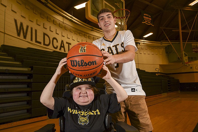 Hixson High School senior Christian Crowe, right, shown with his 12-year-old brother Brenden, has signed with the Bryan College men's basketball program.