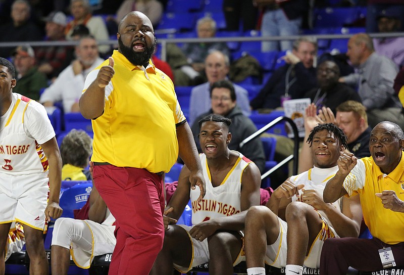 Howard boys' head basketball coach James Talley gives a thumbs up to Marquez Williams (3) as he gets fouled during the Howard vs. East Nashville boys' Class state basketball tournament quarterfinals game Wednesday, March 13, 2019 at the Murphy Center at Middle Tennessee State University in Murfreesboro, Tennessee. Howard lost 75-78.