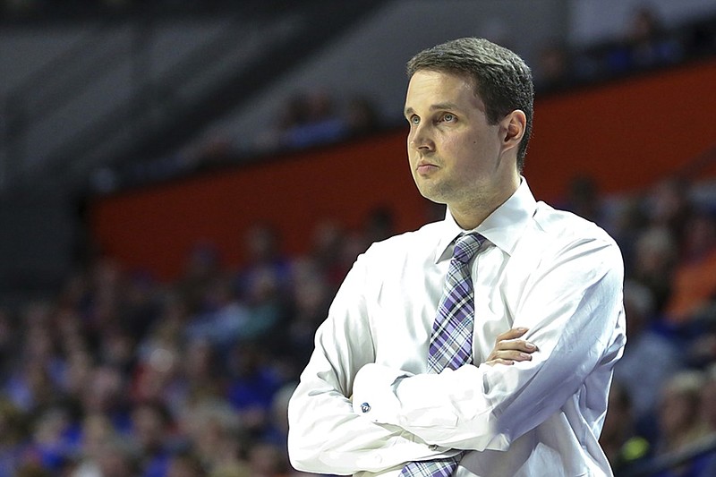 LSU men's basketball coach Will Wade watches his team's game at Florida on March 6. Wade is indefinitely suspended by the school as the Tigers prepare to begin postseason play.