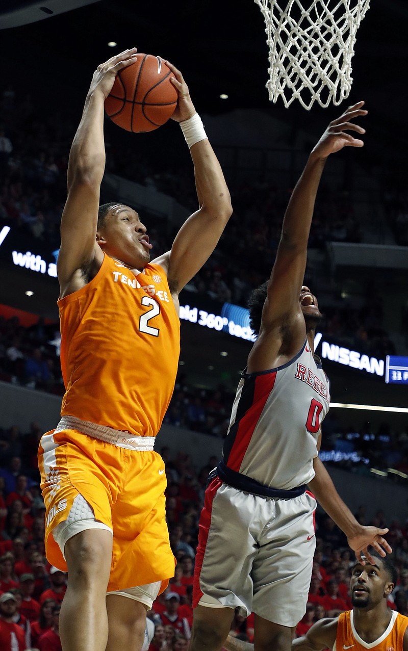 Tennessee forward Grant Williams pulls down a rebound in front of Ole Miss guard Blake Hinson during the Vols' 73-71 win on Feb. 27 in Oxford, Miss. After an incosistent finish to the regular season, the Vols hope for more steady success during the postseason, starting with the SEC tournament.