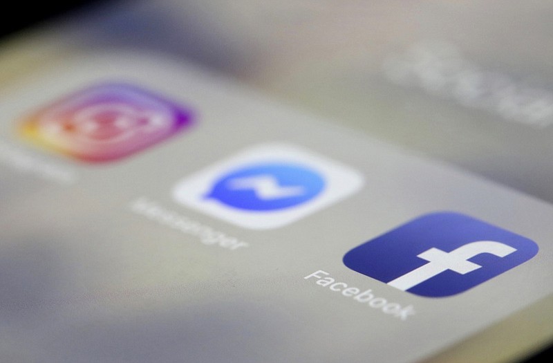 Facebook, Messenger and Instagram apps are are displayed on an iPhone on Wednesday, March 13, 2019, in New York. Facebook says it is aware of outages on its platforms including Facebook, Messenger and Instagram and is working to resolve the issue. (AP Photo/Jenny Kane)