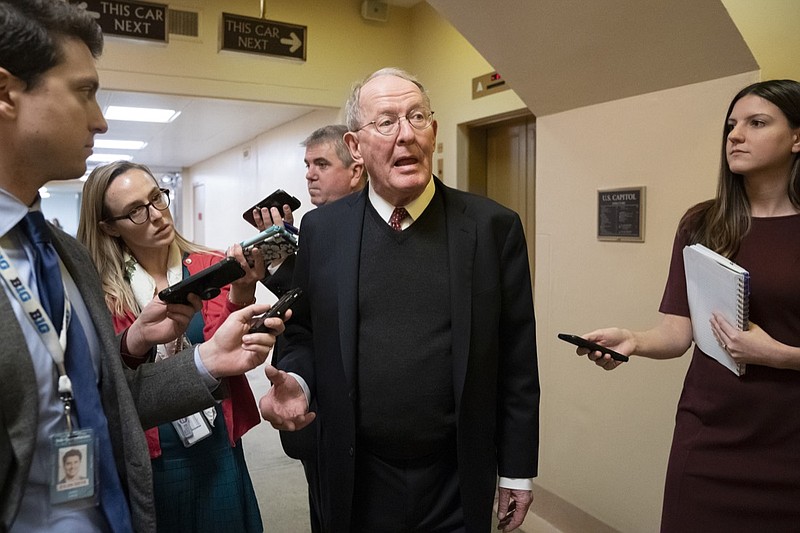 Sen. Lamar Alexander, R-Tenn., tells reporters that he will vote for a resolution to annul President Donald Trump's declaration of a national emergency at the southwest border, on Capitol Hill in Washington, Thursday, March 14, 2019. (AP Photo/J. Scott Applewhite)