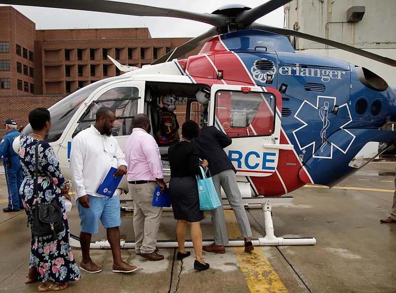 Howard High School educators tour the Life Force helipad at Erlanger Hospital last June in preparation for the launch of the Future Ready Institute at the high school last fall. / Staff File Photo by Doug Strickland