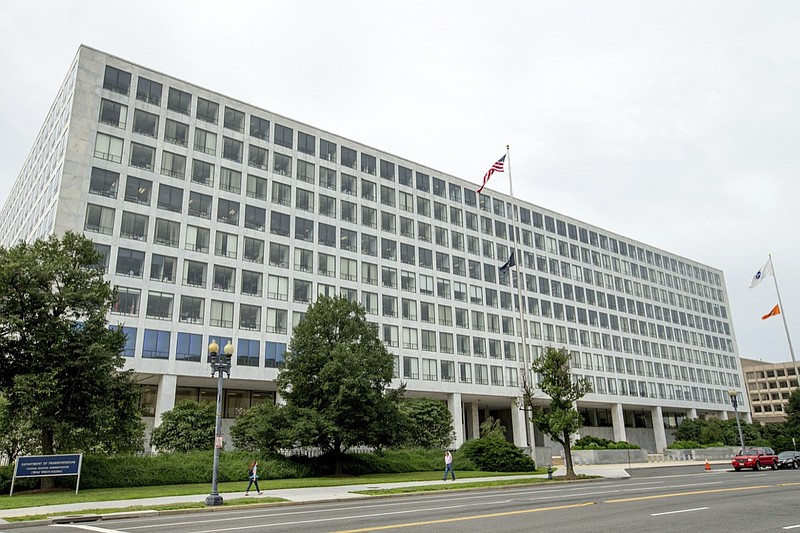 This Friday, June 19, 2015 file photo shows the Department of Transportation Federal Aviation Administration building, in Washington. For more than six decades, the Federal Aviation Administration has relied on employees of airplane manufacturers to do government-required safety inspections as planes are being designed or assembled. But critics say the system, dubbed the "Designee Program," is too cozy as company employees do work for an agency charged with keeping the skies safe while being paid by an industry that the FAA is regulating. (AP Photo/Andrew Harnik, File)