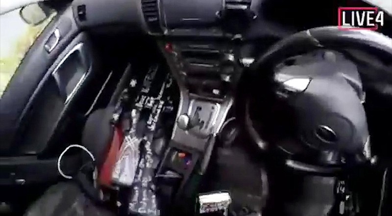 This frame from video that was livestreamed Friday, March 15, 2019, shows guns in the car of a gunman who used the name Brenton Tarrant on social media before the mosque shootings in Christchurch, New Zealand. (Shooter's Video via AP)

