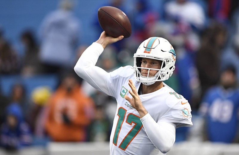 Quarterback Ryan Tannehill warms up before a Miami Dolphins road game against the Buffalo Bills in December. Tannehill has been traded to the Tennessee Titans.