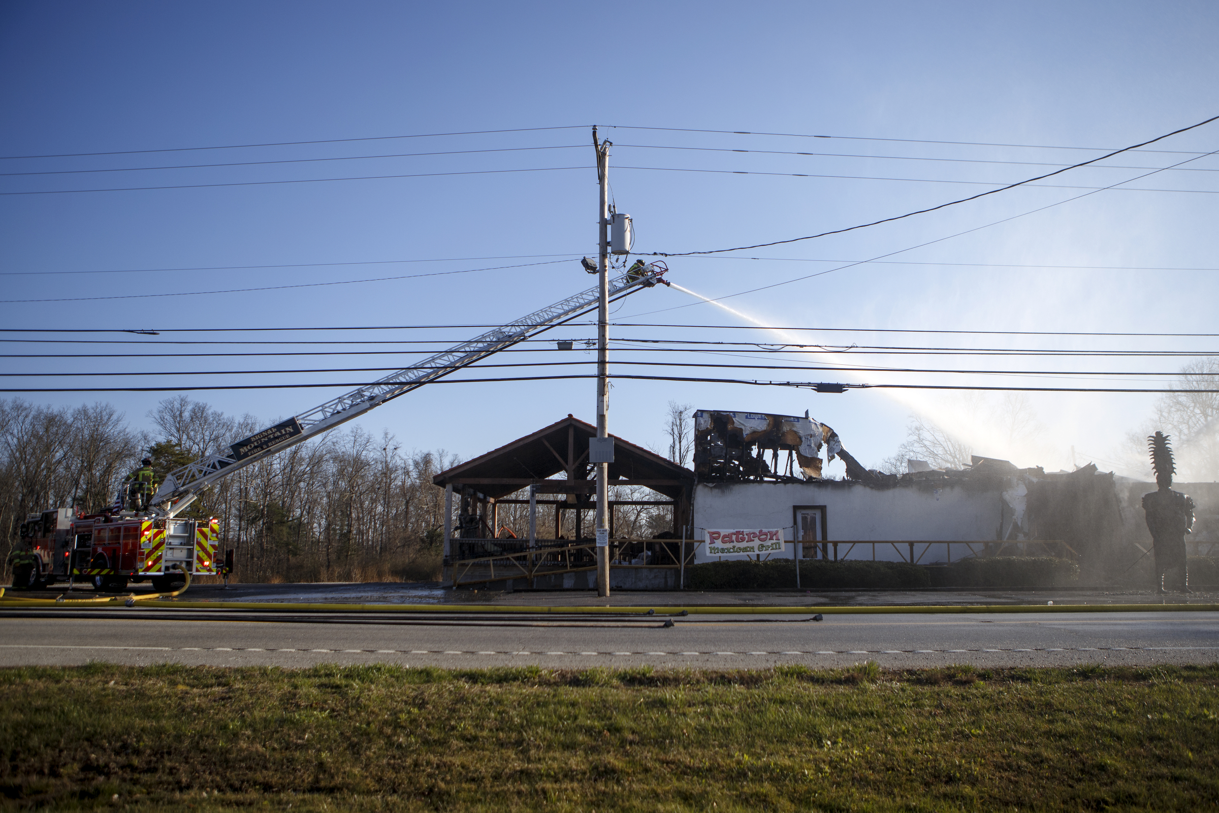 A ladder truck works to put out a fire at Patron Mexican Grill located at 3720 Taft Highway on Monday, March 18, 2019 in Signal Mountain, Tenn.