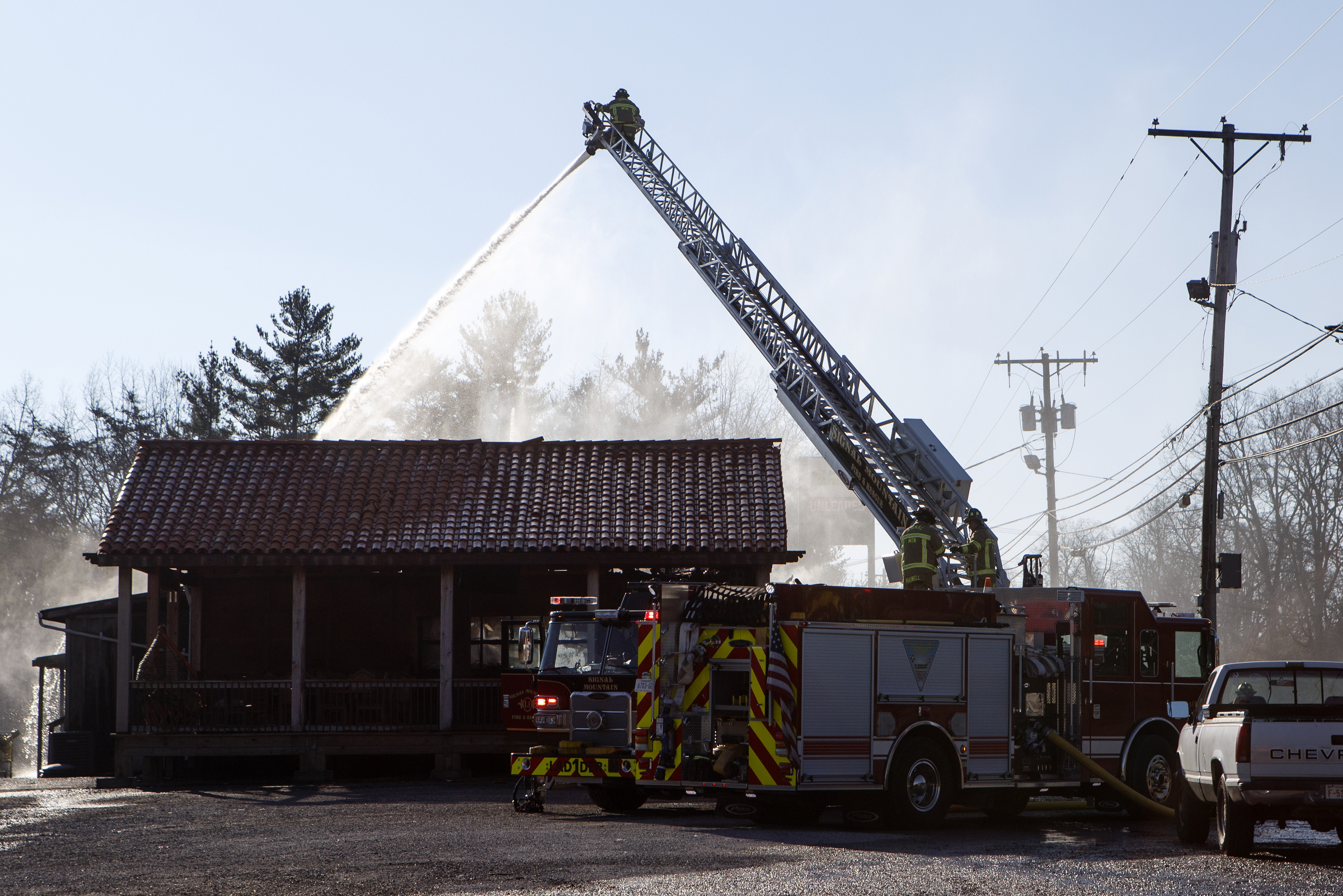 Firefighters work to put out a fire at Patron Mexican Grill located at 3720 Taft Highway on Monday, March 18, 2019 in Signal Mountain, Tenn.