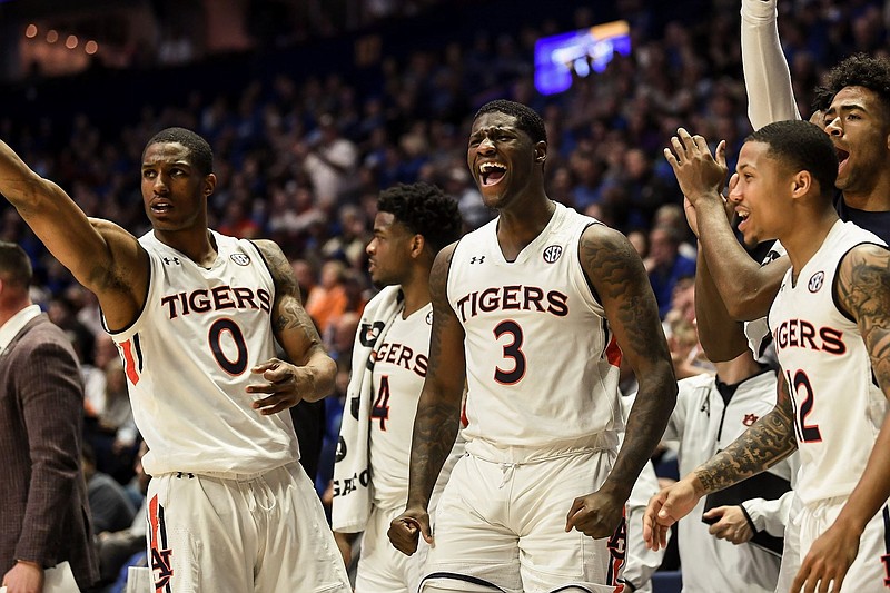 The play of Auburn's backups — including senior forward Horace Spencer (0), junior forward Danjel Purifoy (3) and junior guard J'Von McCormick (12) — helped the Tigers this past weekend win their first SEC basketball tournament title since 1985.