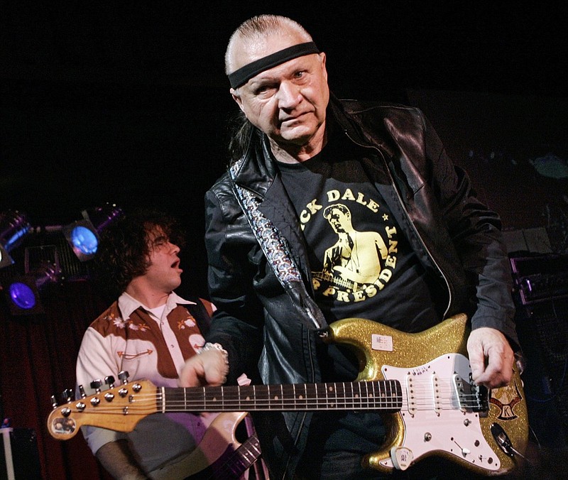 In this May 27, 2007, file photo, Dick Dale, known as "The King of the Surf Guitar," performs at B.B. King Blues Club in New York. Dale has died at age 81. His former bassist Sam Bolle says Dale passed away Saturday night, March 16, 2019. No other details were available. (AP Photo/Richard Drew, File)