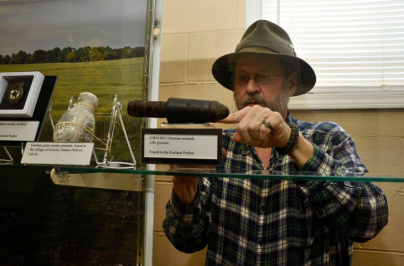 Dr. Steven Nicklas straightens a German rifle antitank grenade. / 6th Cavalry Museum contributed photo