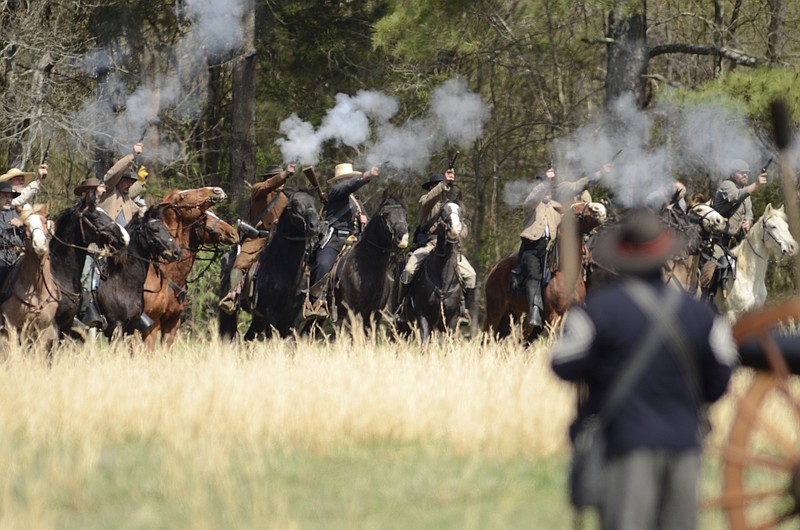 Confederate cavalry and Union soldiers battle in a previous re-enactment at Bridgeport, Alabama.