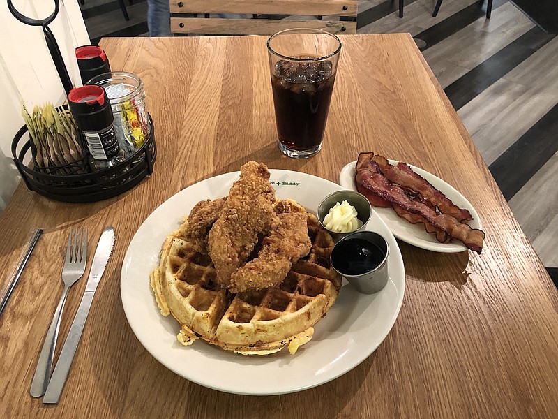 The Fried Chicken & Cheddar Waffle at Bantam + Biddy is served with maple syrup and honey butter. Make it a bacon chedddar waffle or add homemade bourbon-pecan syrup for an additional $1.50 each.