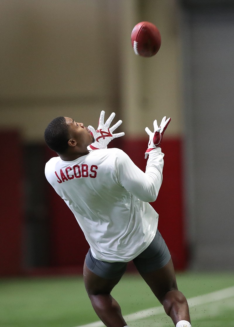 Former Alabama running back Josh Jacobs looks for the ball during Tuesday afternoon's Pro Day in Tuscaloosa.