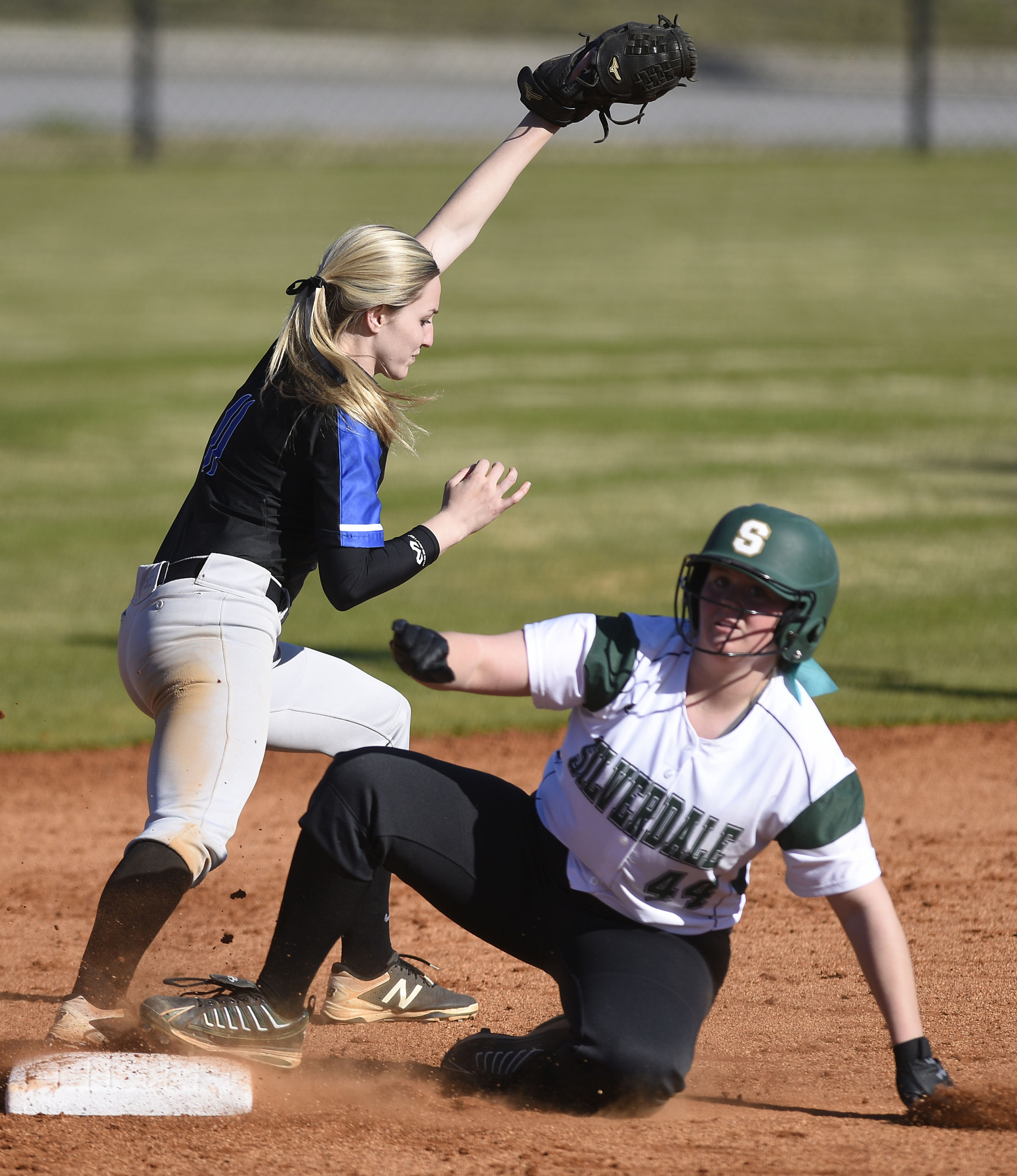 Silverdales McCade Cooper (44) slides safely into second as GPS shortstop Kaitlyn Songer (11) takes the throw. The Silverdale Baptist Academy Lady Seahawks hosted the Girls Preparatory School Bruisers in TSSAA softball action on March 19, 2019.