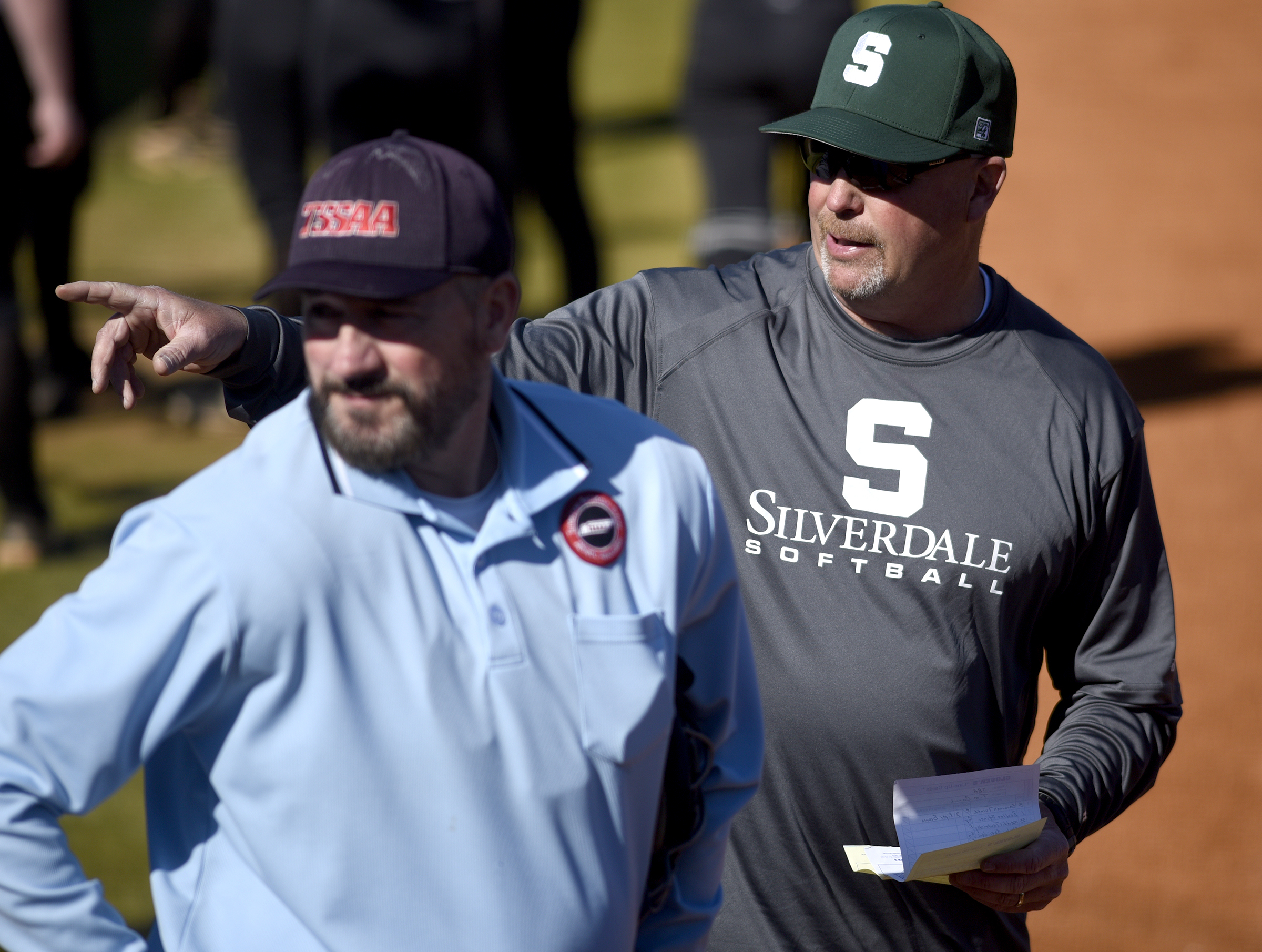 Silverdale head coach Tim Couch explains the ground rules to a umpire. The Silverdale Baptist Academy Lady Seahawks hosted the Girls Preparatory School Bruisers in TSSAA softball action on March 19, 2019.