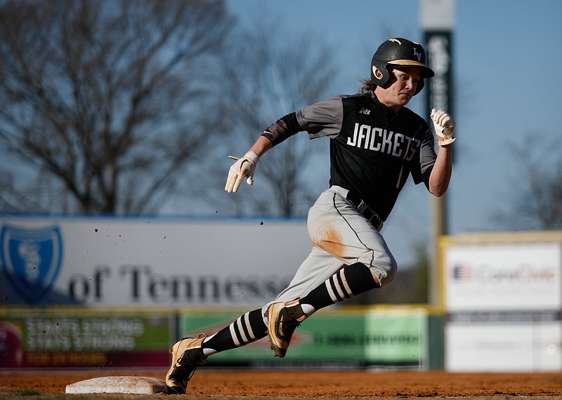 Lookout Valley runner Zane Howard rounds third headed for home during the 18-1 district win over Sale Creek on Tuesday night at AT&T Field.