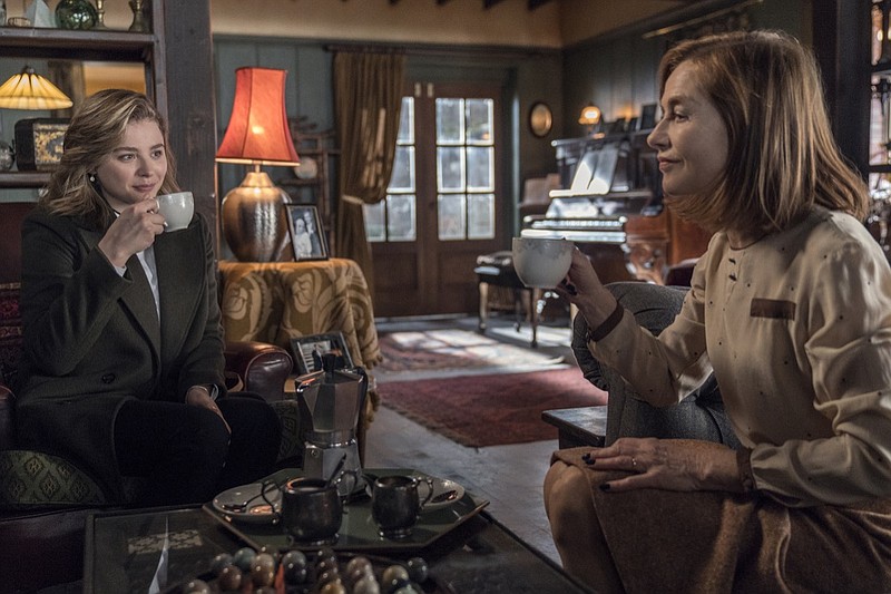 This image released by Focus Features shows Chloë Grace Moretz, left, and Isabelle Huppert in a scene from "Greta." ( Jonathan Hession/Focus Features via AP)