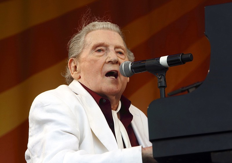 In this May 2, 2015, file photo, Jerry Lee Lewis performs at the New Orleans Jazz & Heritage Festival in New Orleans. Lewis has been transferred from a hospital to a rehabilitation center following a stroke last month, but will have to cancel upcoming shows, including his appearance at the New Orleans Jazz Festival. According to a statement from his neurologist released Monday, March 18, 2019, the 83-year-old Lewis is expected to fully recover with aggressive and intensive rehab. (Photo by John Davisson/Invision/AP, File)