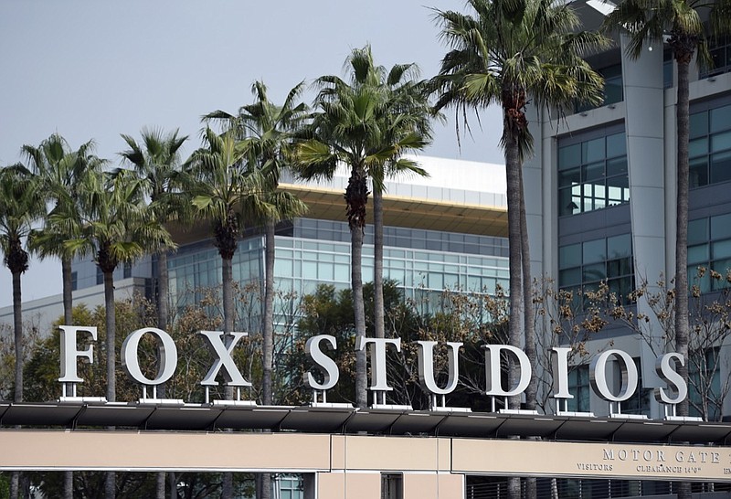 The Fox Studios sign is pictured at the entrance to the lot, Tuesday, March 19, 2019, in Los Angeles. Disney's $71.3 billion acquisition of Fox's entertainment assets is set to close around 12 a.m. EDT on Wednesday. (AP Photo/Chris Pizzello)

