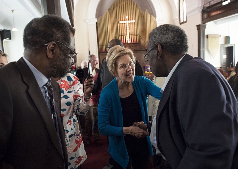 Democratic presidential candidate Sen. Elizabeth Warren, D-Mass., shakes hands with Alabama State Sen. Henry Sanders at the Brown Chapel AME Church in Selma, Ala., on Tuesday, March 19, 2019. (Jake Crandall/The Montgomery Advertiser via AP)

